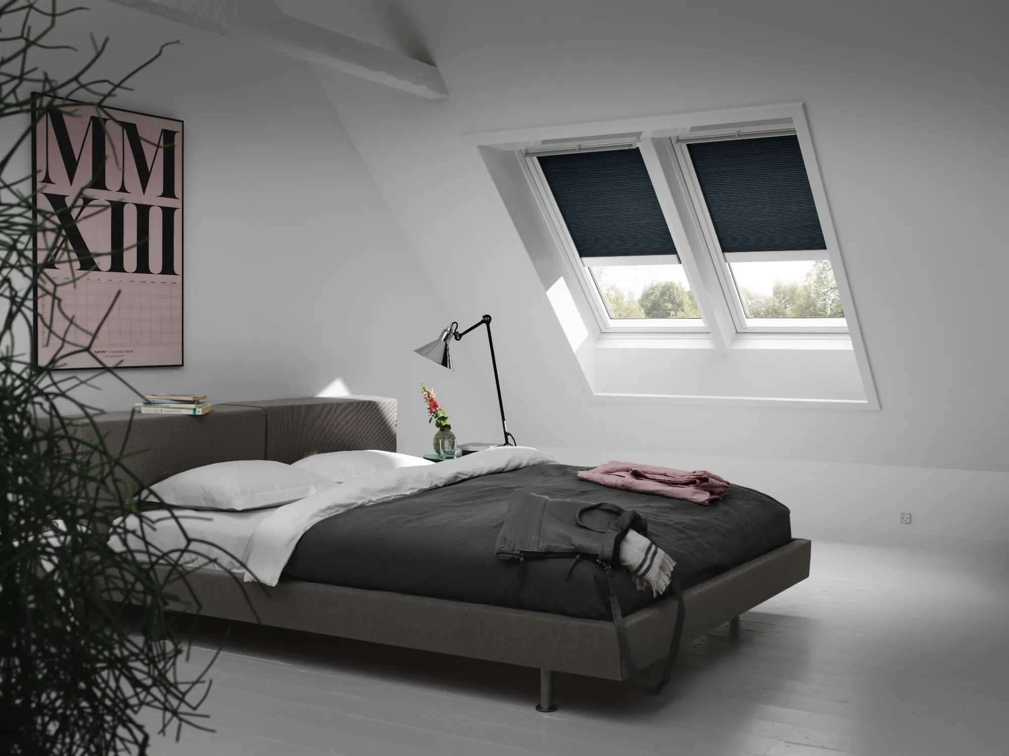 A bedroom with a bed and a window.