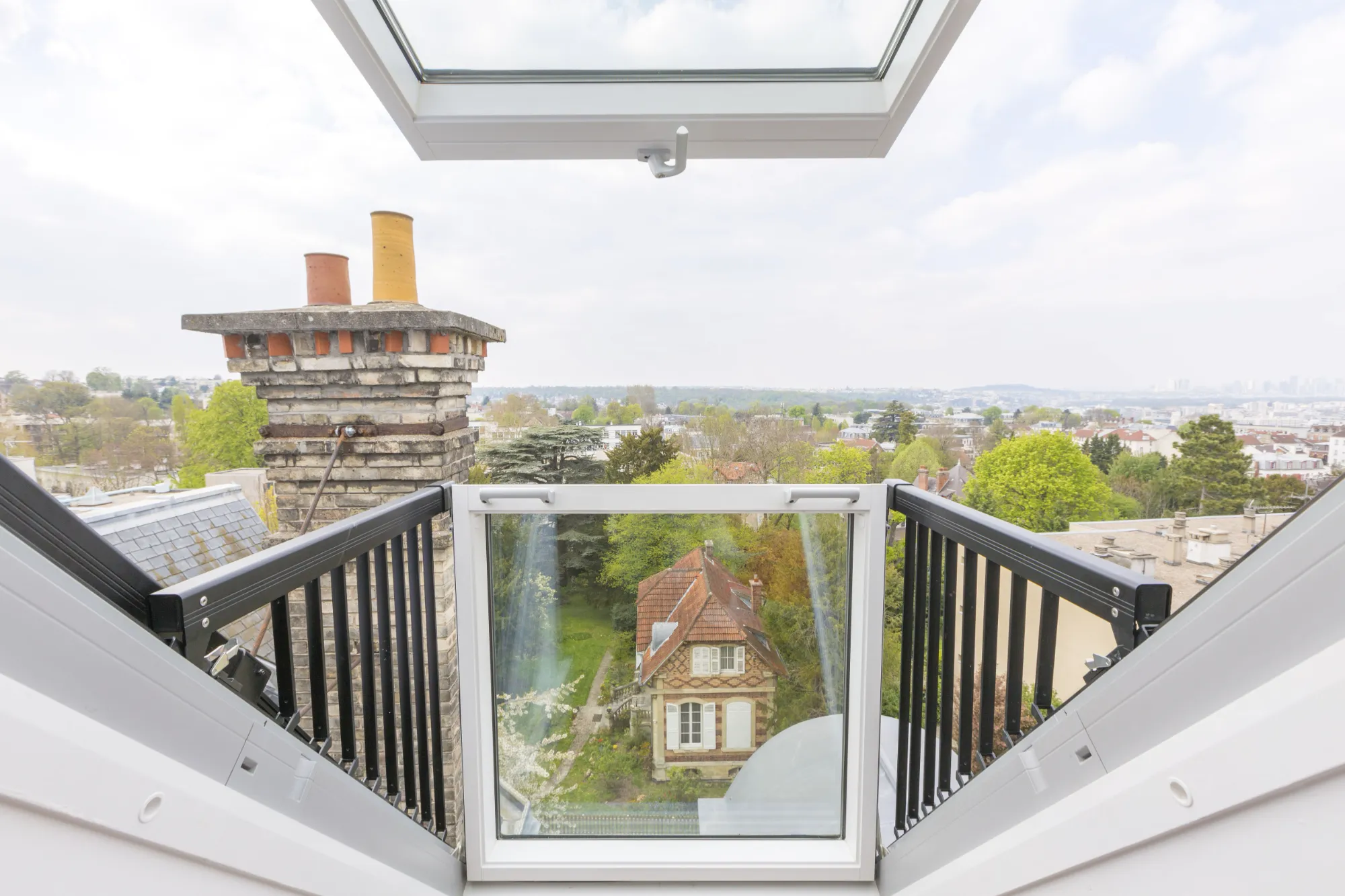 A view of a house from the top of a staircase.