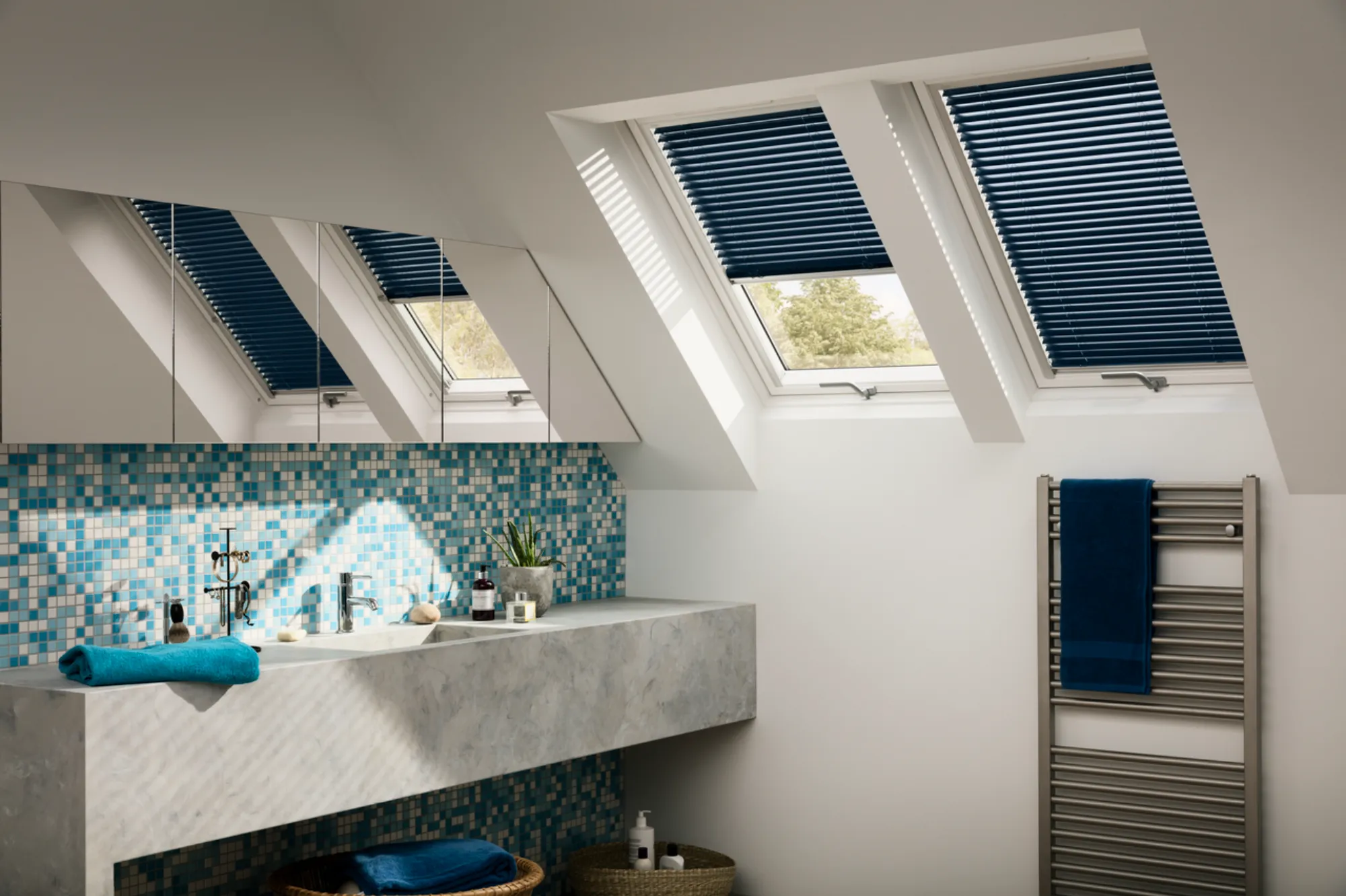 A bathroom with a skylight and a sink.