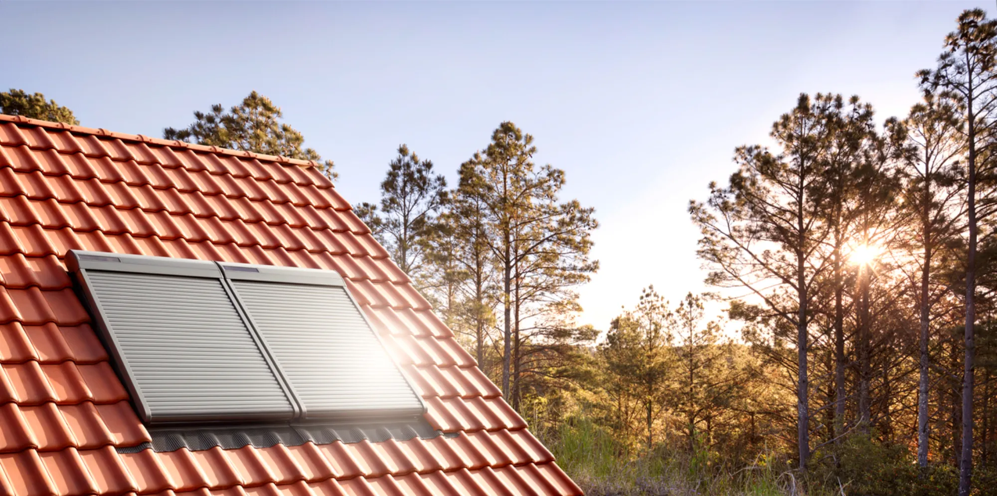 A red tiled roof with a window on it.